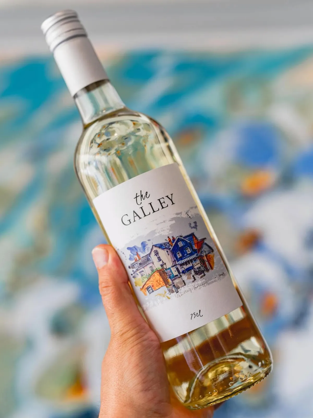 A bottle of The Galley house white wine with its watercolour Topsham label